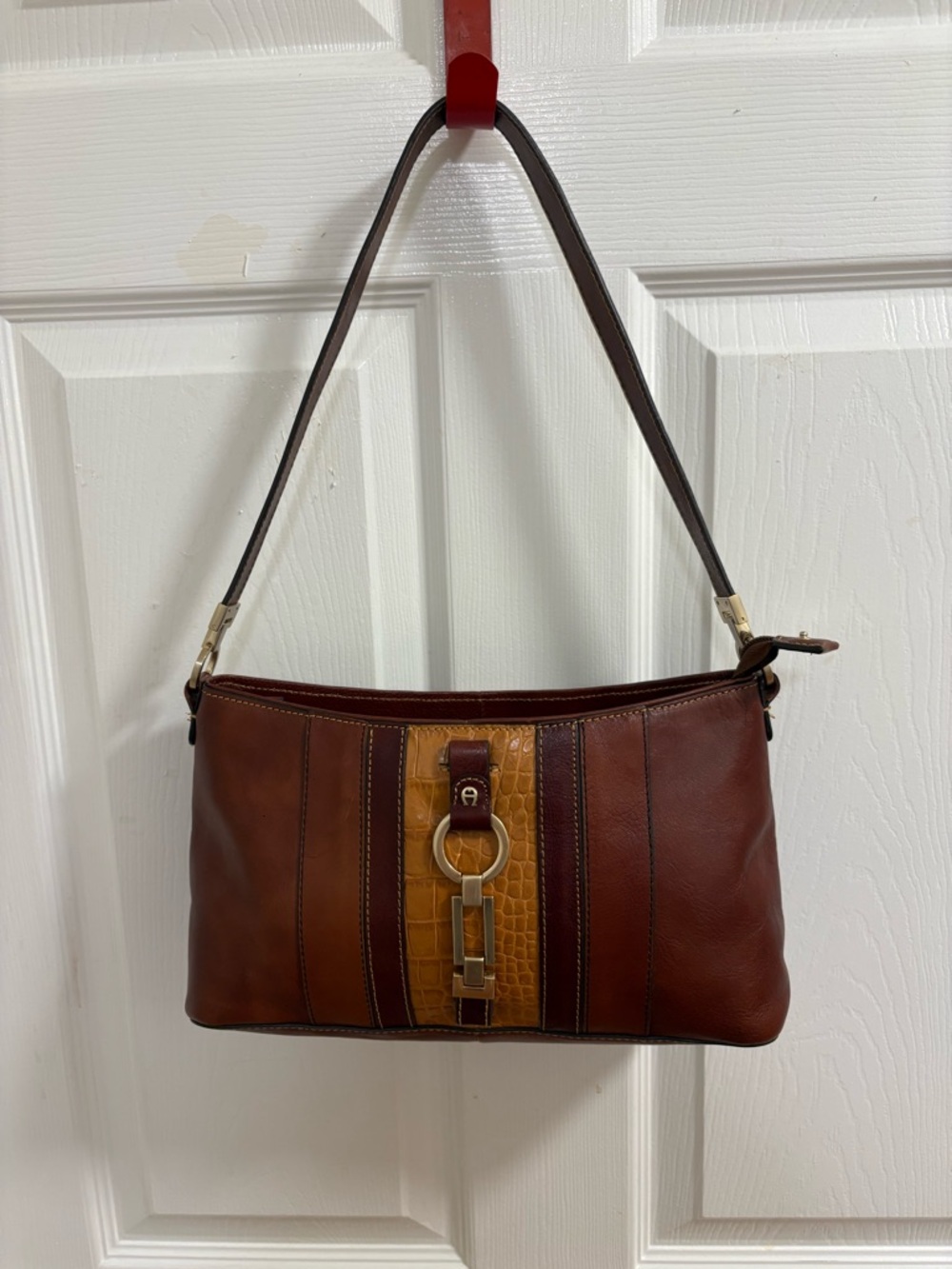 Etienne Aigner brown leather bag featuring a crocodile-embossed central panel